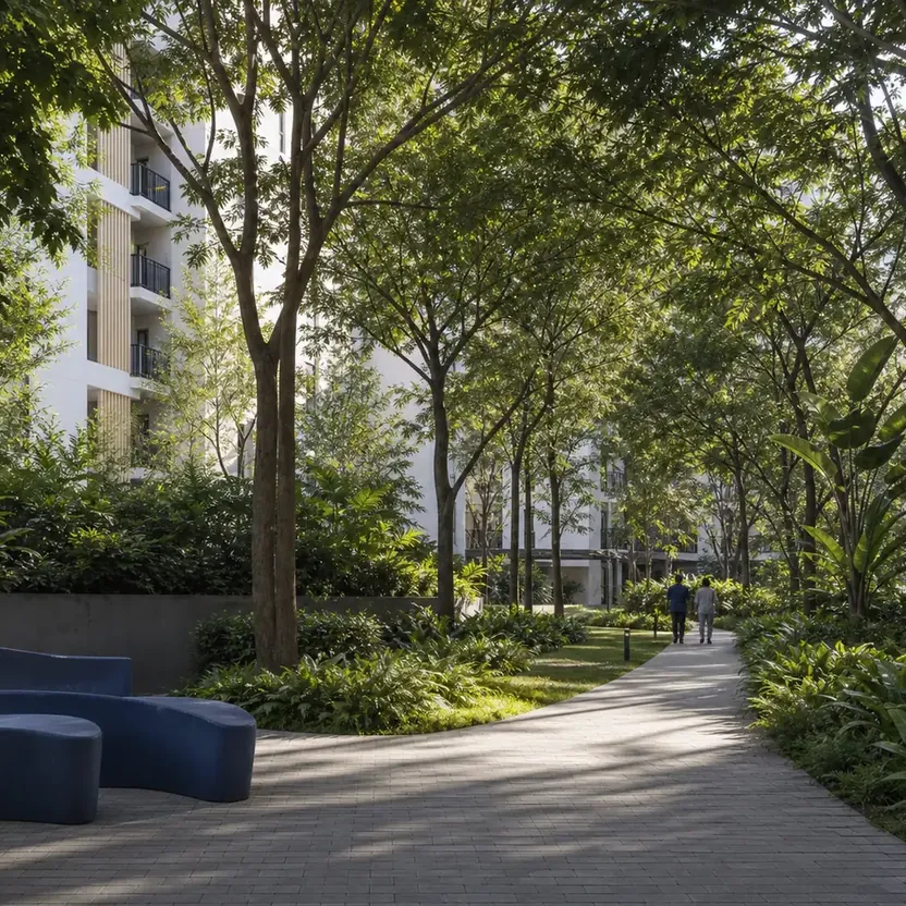 Urbanrise The Living Wave Shaded walkway under a tree canopy between the towers