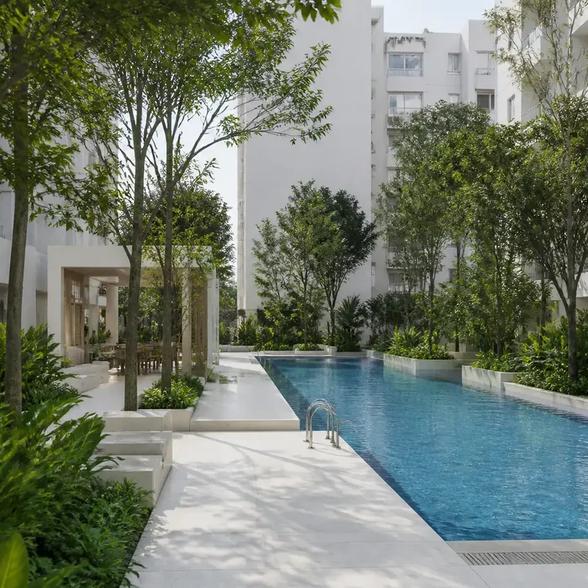 Urbanrise The Living Wave Swimming pool between the towers, lined with trees